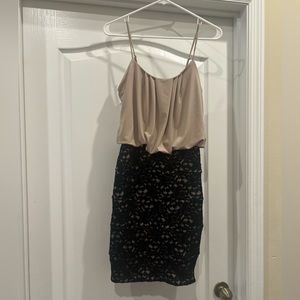 Women’s tan and black lace mini dress